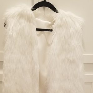 White fur long vest.  Fur not real.